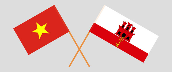 Crossed flags of Vietnam and Gibraltar. Official colors. Correct proportion