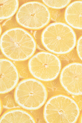 A slices of fresh juicy yellow lemons.  Texture background, pattern.