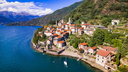Fototapeta na wymiar Stynning idyllic lake scenery, amazing Lago di Como. Aerial view of beautiful medieval village Dervio. Italy, Lombardia