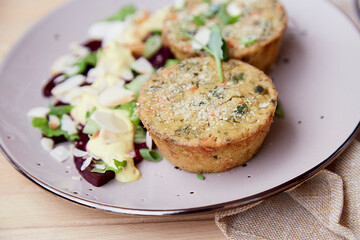 Vegan muffins with pea sprouts, beetroot salad, herbs and vegetables close up.