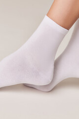 Woman wearing white socks for foot care
