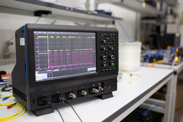 Professional digital oscilloscope oscillograph at tech lab. - obrazy, fototapety, plakaty