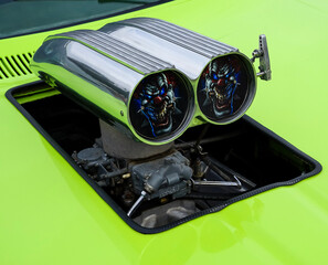 air intake trumpet on green car