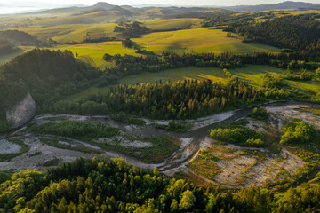 Bialka River in Podhale region, High tatras mountains in Poland at sunset. Drone View