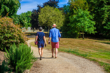 middle aged couple walking on footpath