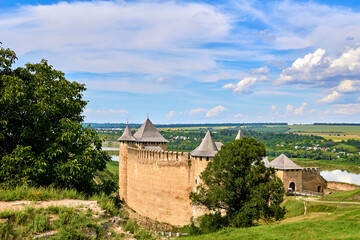 Old medieval fortress castle museum on green hills by the river