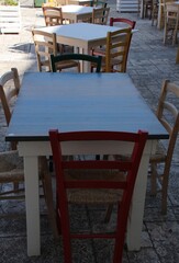Italy, Salento: Outdoor tables and chairs of a restaurant.