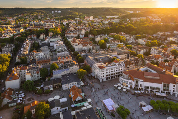 Aerial view of Sopot and the buildings of the seaside village. A warm summer afternoon creates a pleasant atmosphere in the photo. - obrazy, fototapety, plakaty