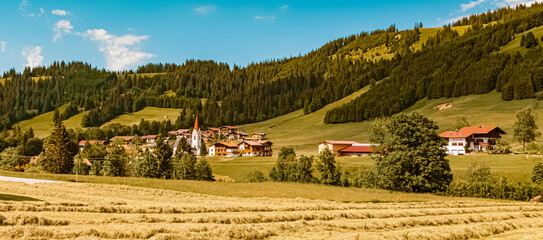 Beautiful alpine summer view with a church near Schattwald at the famous Tannheimer Tal valley, Tannheim, Tyrol, Austria