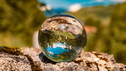 Crystal ball alpine landscape shot at the famous Fuessener Joechle summit, Tannheim, Tyrol, Austria