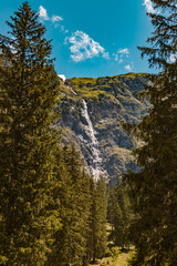 Beautiful alpine summer view with a waterfall at the famous Vilsalpsee, Tannheimer Tal valley, Tannheim, Tyrol, Austria