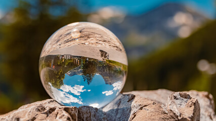 Crystal ball alpine landscape shot at the famous Vilsalpsee lake, Tannheim, Tyrol, Austria