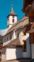 Fototapeta na wymiar Beautiful church on a sunny summer day at the famous Tannheimer Tal valley, Zoeblen, Tyrol, Austria