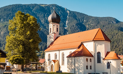Fototapeta na wymiar Beautiful church on a sunny summer day at Weissenbach, Lech, Tyrol, Austria
