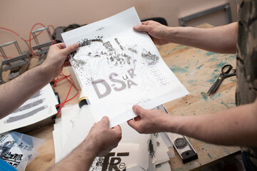 Serigraphy silk screen print process at clothes factory. Pattern stencil template frame.