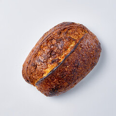 Handmade bread on a white background, top view