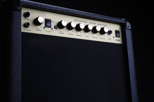 Black Guitar Amplifier, Amp On A Black Background, Close Up. Instruments Equipment.