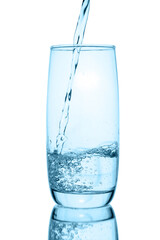 pouring water into glass isolated on white background