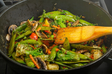 Stewed vegetables in yakisoba sauce roccoli mushrooms and green peas.