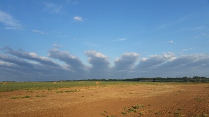 Fototapeta na wymiar Special clouds on the farm, red river, Texas Sky, blue sky
