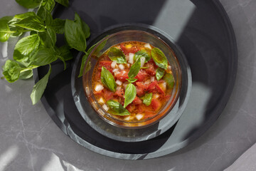 Tomato and fresh basil in sunlight