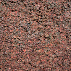 Pink rock texture, pink granite stone from Brittany close up. Cote d'Armor