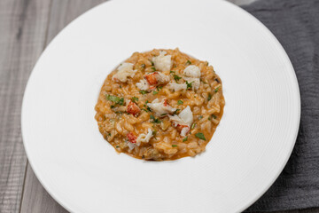 Italian lobster risotto on white plate