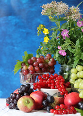 Colorful still life with seasonal fruit and berries on textured background with copy space. Balance diet concept. 