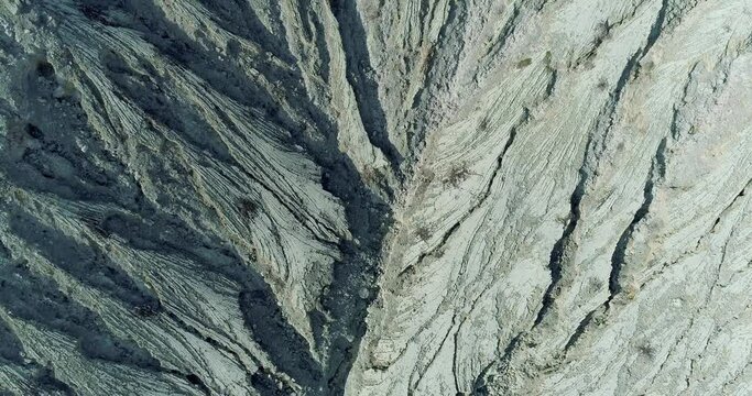 Aerial view of relief volcanic hill in the crater of Ijen volcano, Java Island, Indonesia 4K