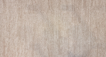 close up of monochrome beige or brown carpet texture background from above. texture tight weave...