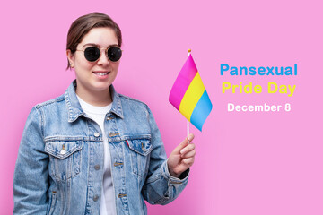 Young girl hold Pansexual flag. Celebrate Pansexual Pride Day.