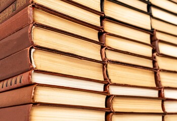 Many classic books in heaps. Novels collection in library or at home. Education, wisdom, preparing for exams, project conducting, knowledge-enhancement concept. High quality photo