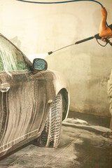 Black car getting wash with soap.