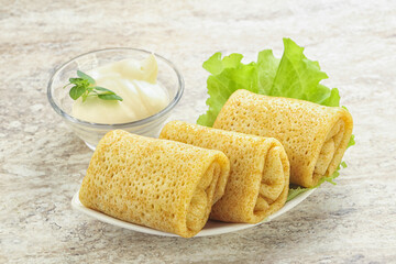 Stuffed pancakes with meat and cream