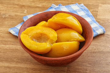 Sweet canned peaches with syrope