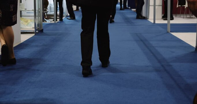 Business people walking through conference venue at global event