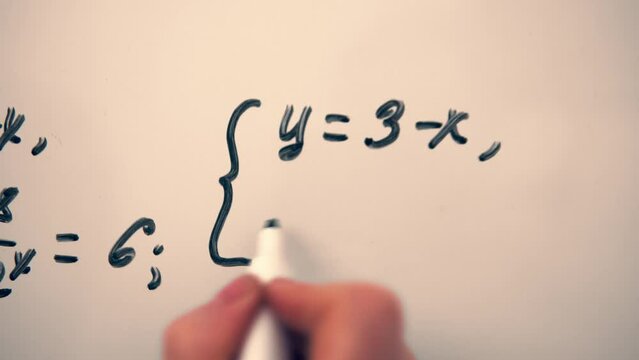 Mathematics equation on whiteboard. Math algebra lessons, education concept.