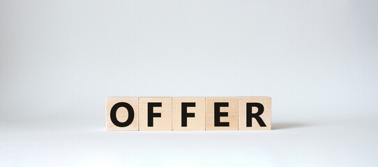Offer symbol. Wooden cubes with word Offer . Beautiful white background. Offer concept. Copy space.