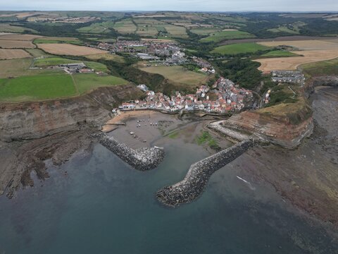 aerial view of Staithes seaside village and fishing port in the borough of Scarborough in North Yorkshire, England