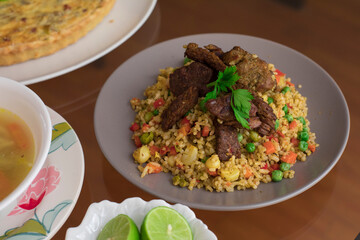 Green rice with meat Buffet table peruvian food gourmet restaurant