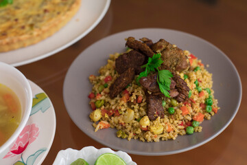 Green rice with meat Buffet table peruvian food gourmet restaurant