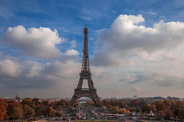 side view of the eiffel tower with the seine river beside it