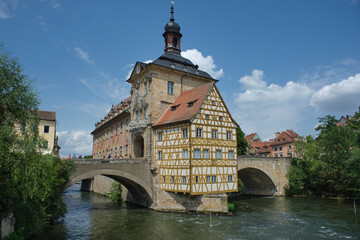 Bamberg. Panoramic view of Old Town Hall of Bamberg (Altes Rathaus) with two bridges over the Regnitz river, Bavaria, Germany