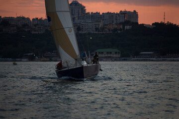 Sailing yacht regatta. Sailboats under sail in the race. Yachting. Luxury yachts.