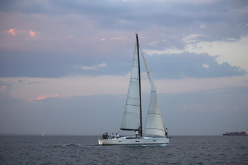 Fototapeta na wymiar Sailing yacht regatta. Sailboats under sail in the race. Yachting. Luxury yachts.