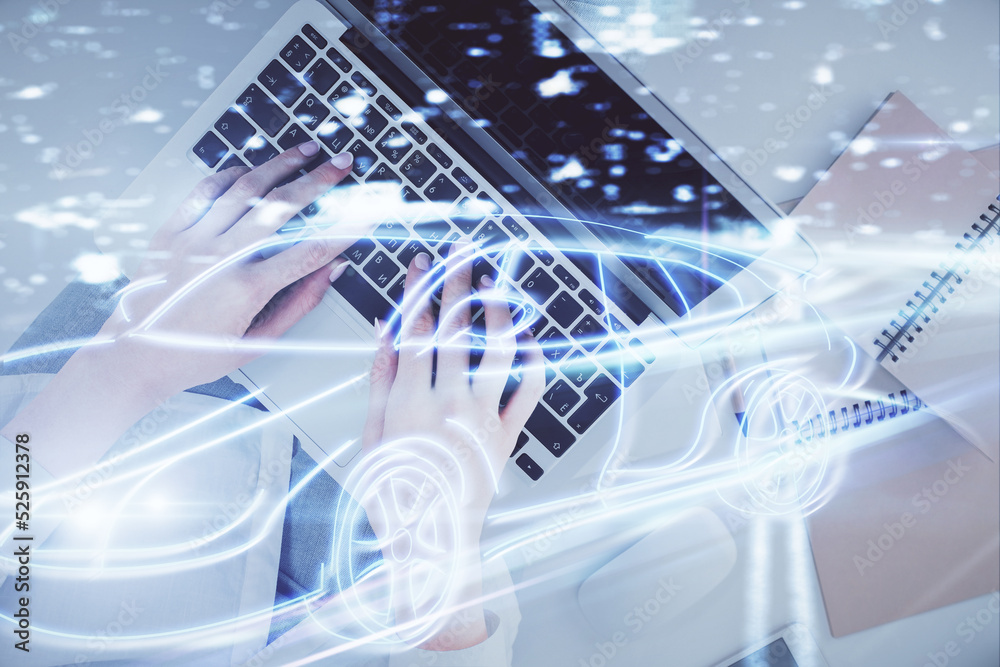 Poster double exposure of woman hands working on computer and car hologram drawing. top view. auto pilot co
