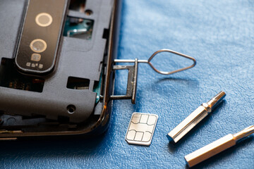 Fototapeta premium Disassembled mobile phone, phone repair and maintenance