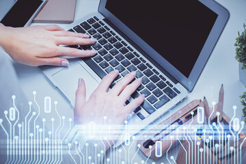 Double exposure of woman hands working on computer and data theme hologram drawing. Tech concept.