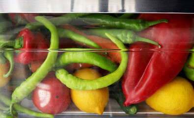 assorted vegetables and fruits in the refrigerator