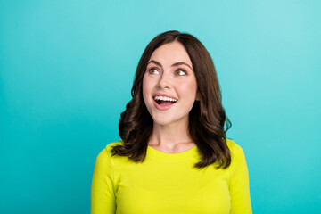 Photo of impressed brunette hair millennial lady look promo wear green shirt isolated on teal color...